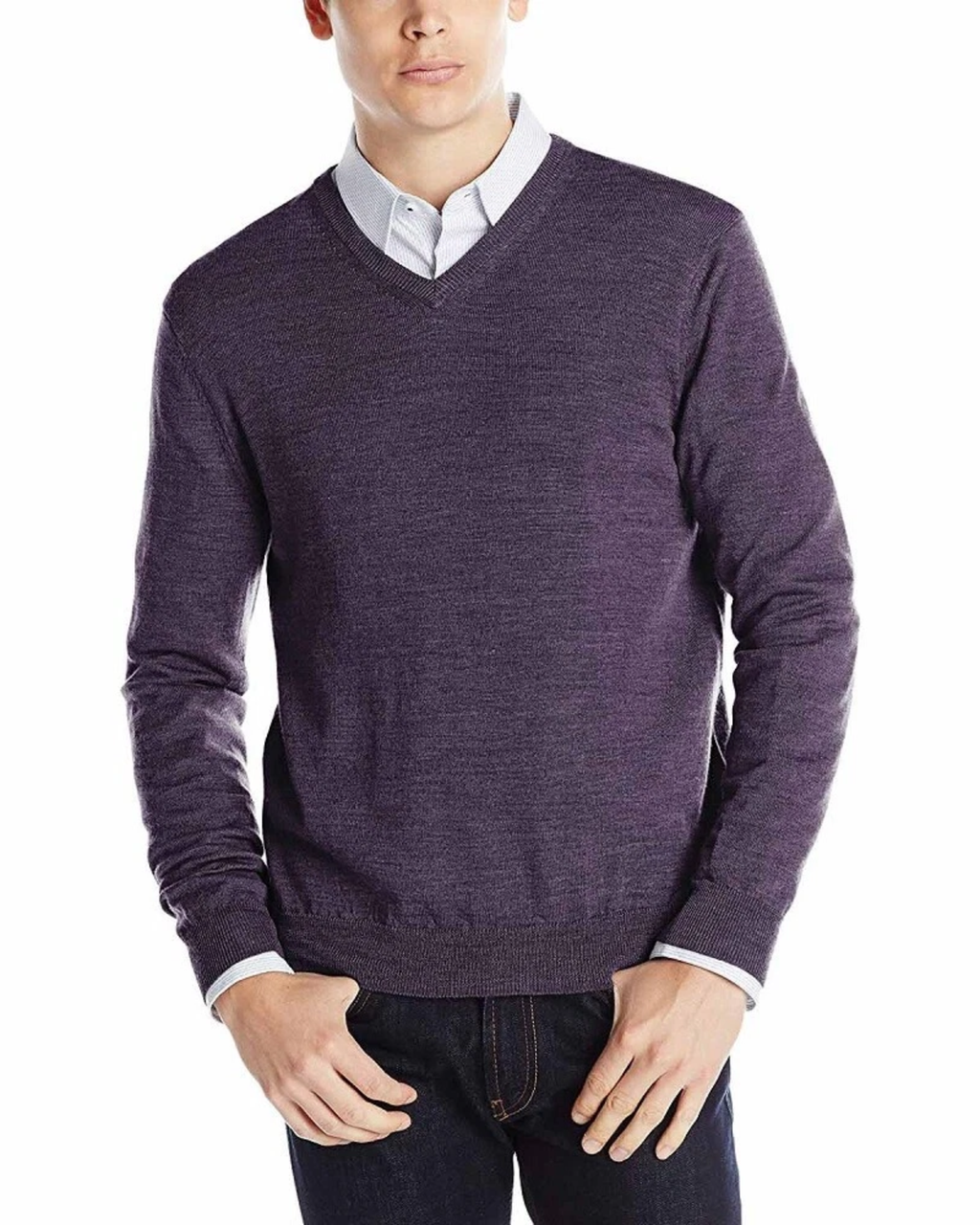 Man wearing a purple sweater over a white shirt on a white background
