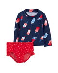 Children's swim set with navy top and red bottom featuring ice cream pattern on a white background