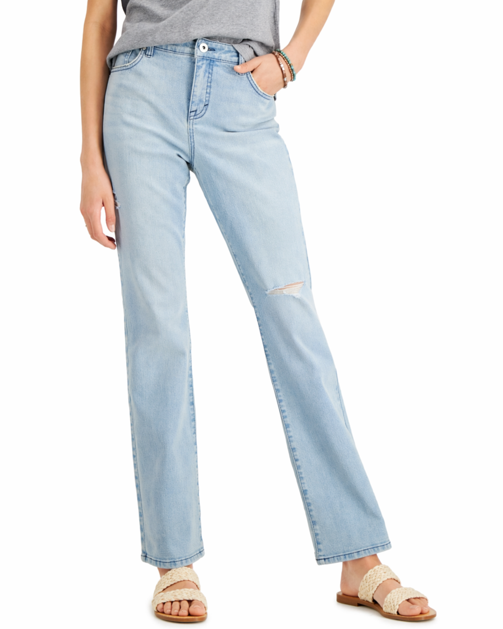 Light blue jeans worn by a person on a white background