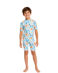 Child wearing a blue swimsuit with animal prints on a white background