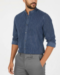 Man wearing a blue striped shirt and gray pants 