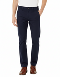 Navy pants worn by a person on a white background