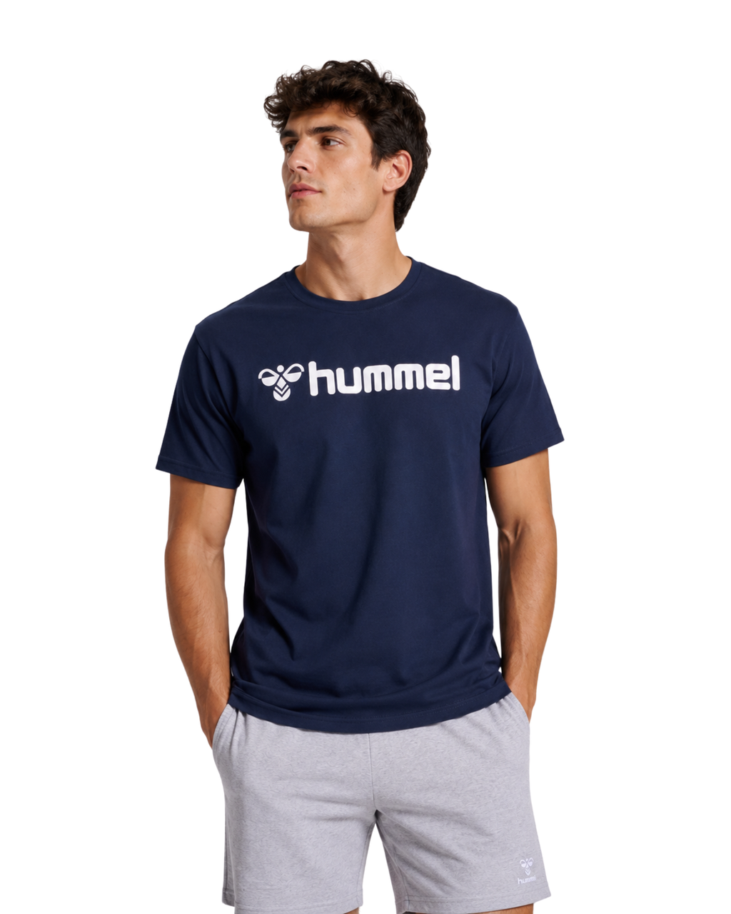 Man wearing Navy Top with grey short