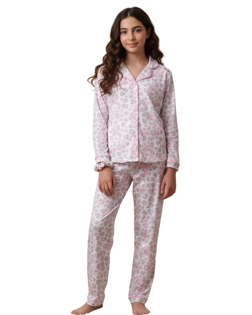 Woman wearing a pink floral pajama set on a white background