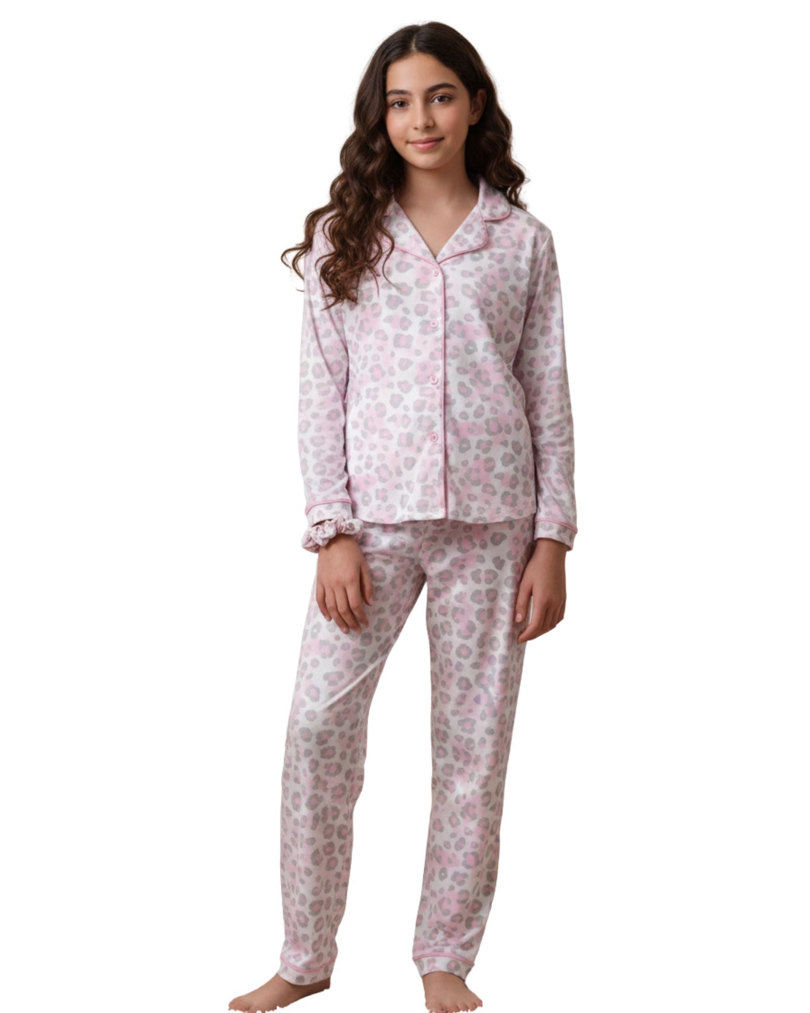 Woman wearing a pink floral pajama set on a white background