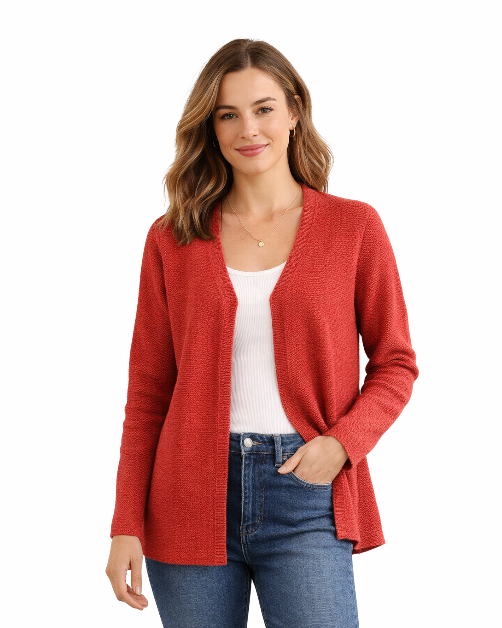 Woman wearing a red cardigan over a white shirt and blue jeans on a white background