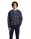 Teenager men wearing a navy Champion sweatshirt with logo pattern on a white background