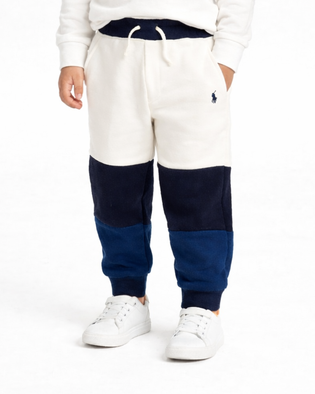 Color-blocked sweatpants with a logo on a white background