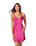 Woman wearing a pink slip dress on a white background