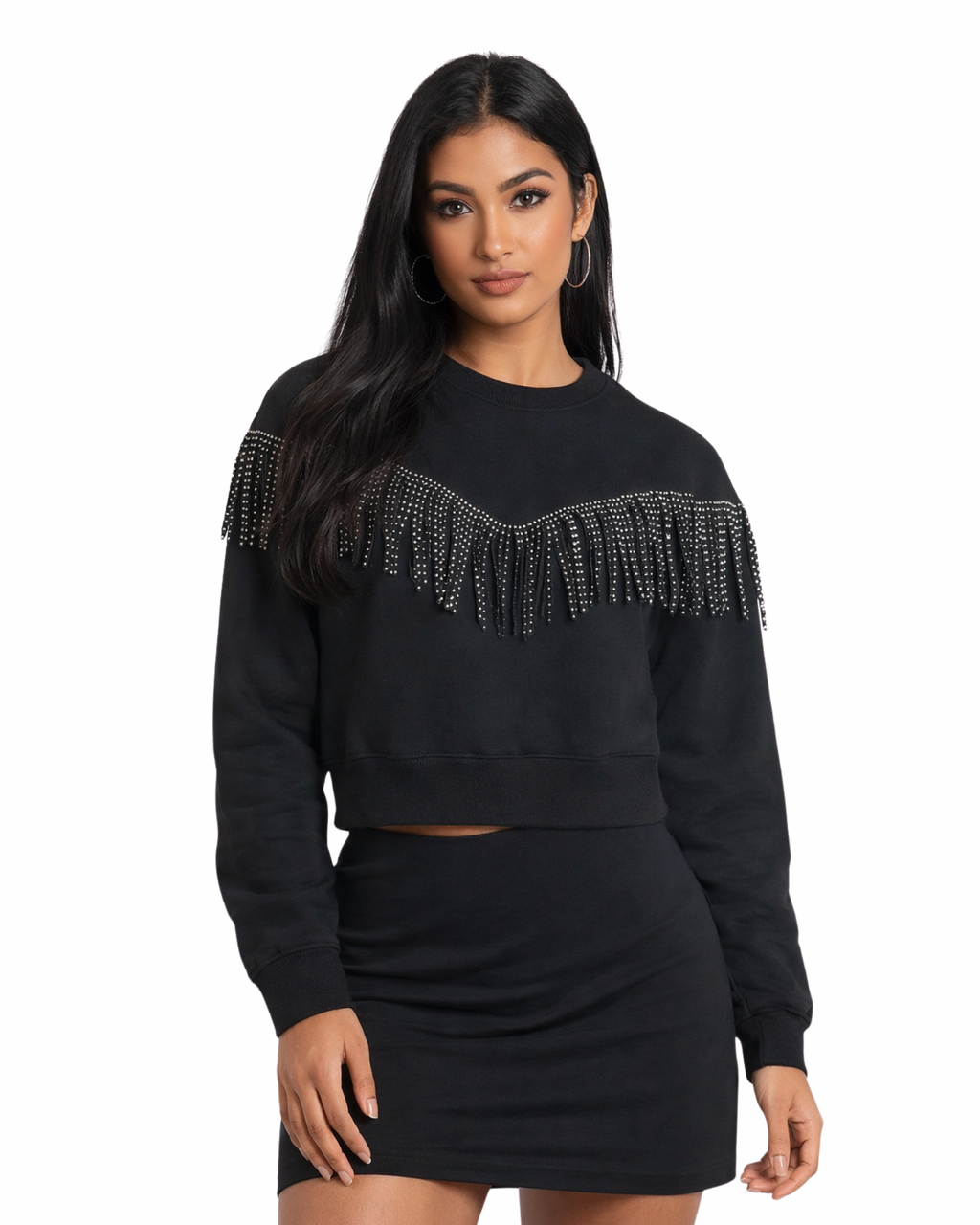 Black sweater with rhinestone fringe and matching skirt on a white background