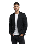 Man wearing a black blazer over a white shirt 