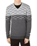 Person wearing a gray patterned sweater on a white background