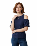 Woman wearing a navy blue off-shoulder top and jeans on a white background