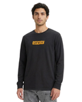 Man wearing a black Levi's long-sleeve shirt on a white background