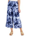 Person wearing blue tie-dye wide-leg pants on a white background
