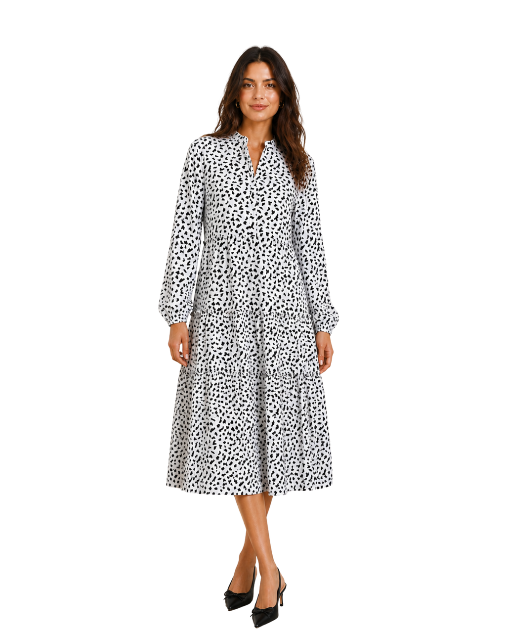 Woman wearing a black and white patterned dress on a white background