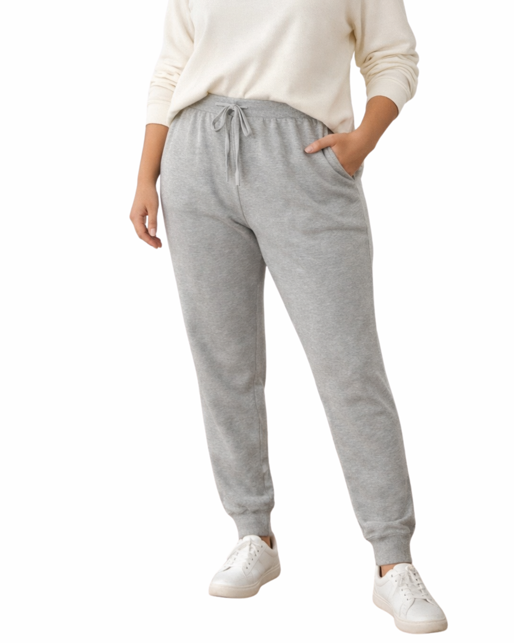 Person wearing gray sweatpants and a white sweater on a white background