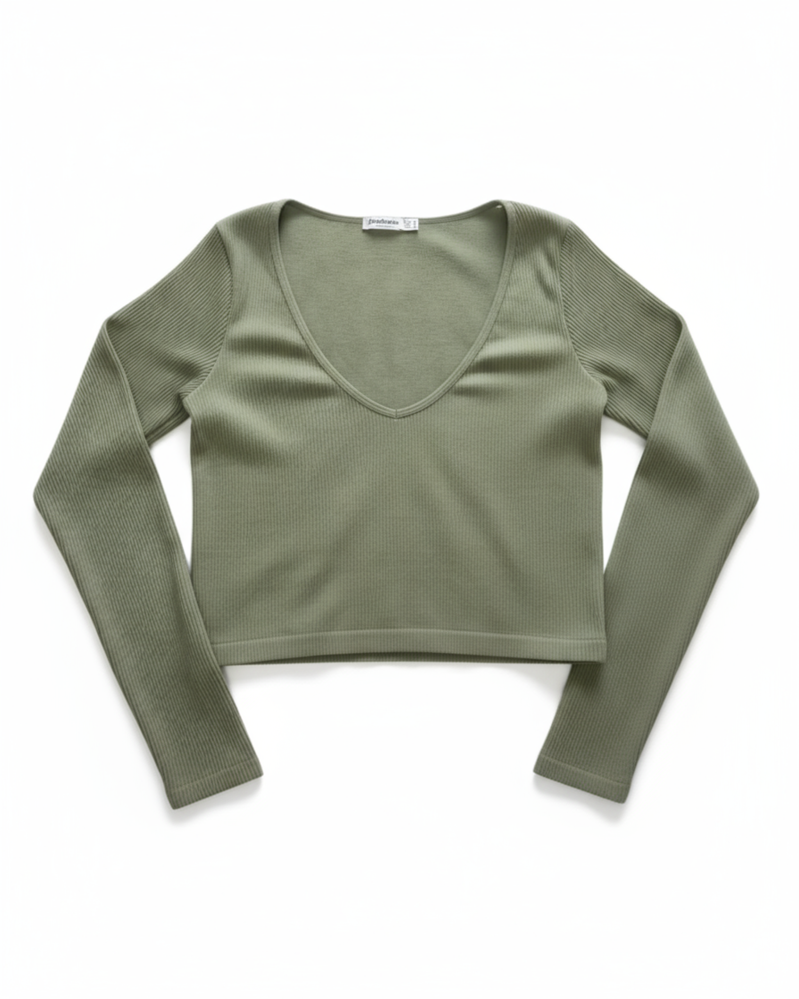 Green long-sleeve crop top on a white background